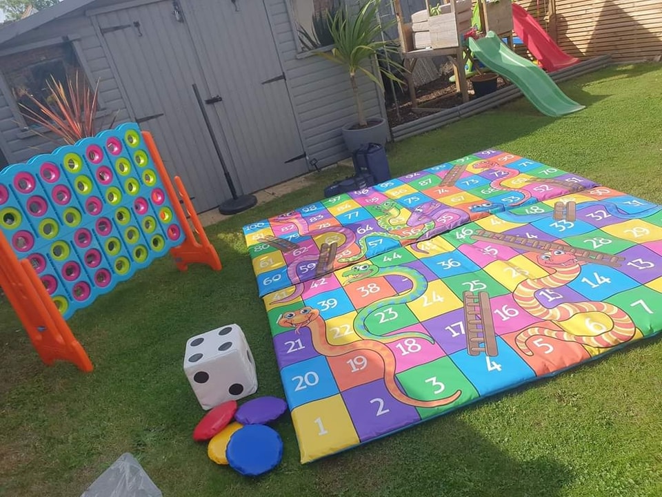Giant snakes and ladders game